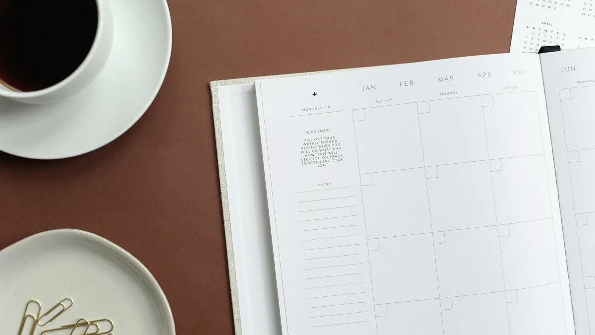 An open year planner with columns for January to June, beside a cup of coffee on a warm brown desk